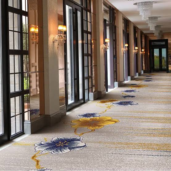 Patterned statement carpet in a hotel corridor